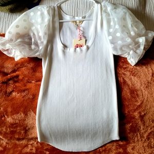 White shirt with pom pom shoulders